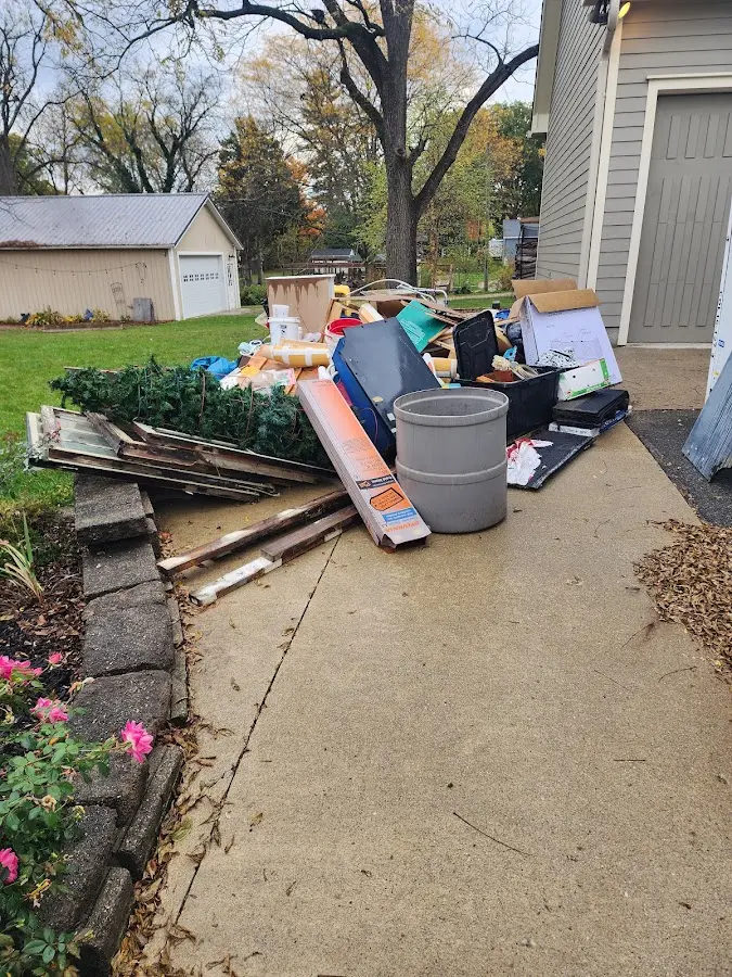 Dumpster being loaded with debris for Estate Cleanout Dumpster Rental in Helena Valley West Central